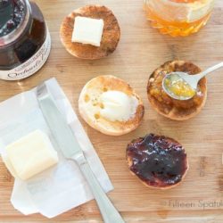 English Muffin Recipe Served Toasted on Wooden Board with butter and jams