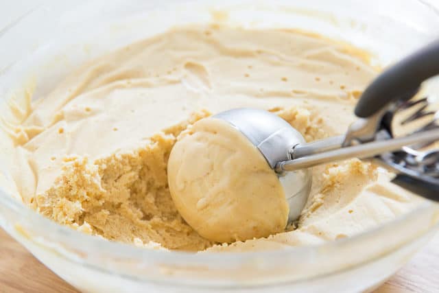 Scooping Peanut Butter Semifreddo Ice Cream Out Of Frozen Container with Cookie Scoop