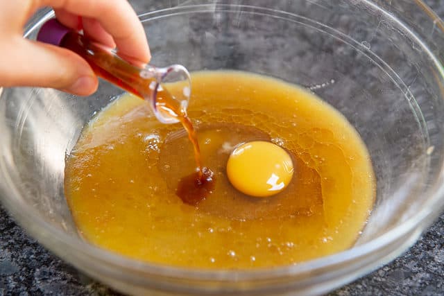 Egg and Vanilla Extract Added to the Bowl