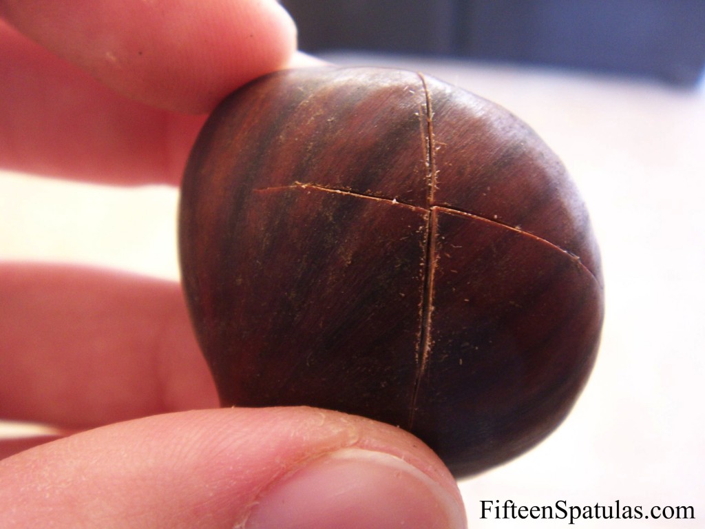 A Shell-On Chestnut with an X Cut Into It