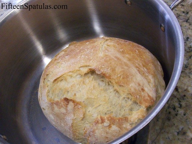 Dutch Oven Baked Bread Loaf - Fully Golden and Caramelized Crust in Pot