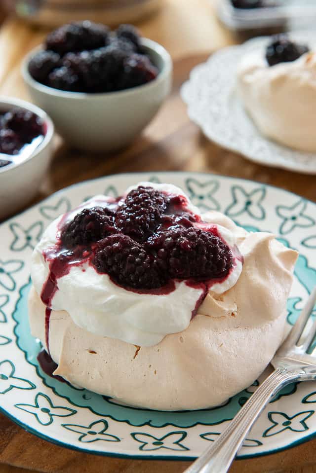 Pavlova - On a Blue Plate with Cream and Blackberries On Top
