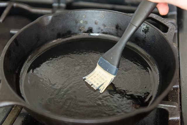 Brushing Cast Iron Skillet With Oil 