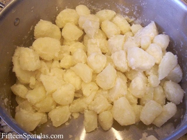 Parboiled Potato Chunks Shaken in a Big Pot with Flour