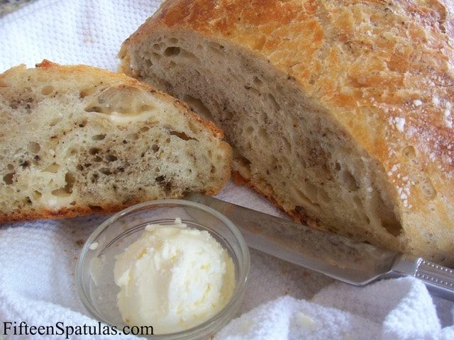 Parmesan Peppercorn Bread - Sliced and Served With Freshly Whipped Butter in Bowl