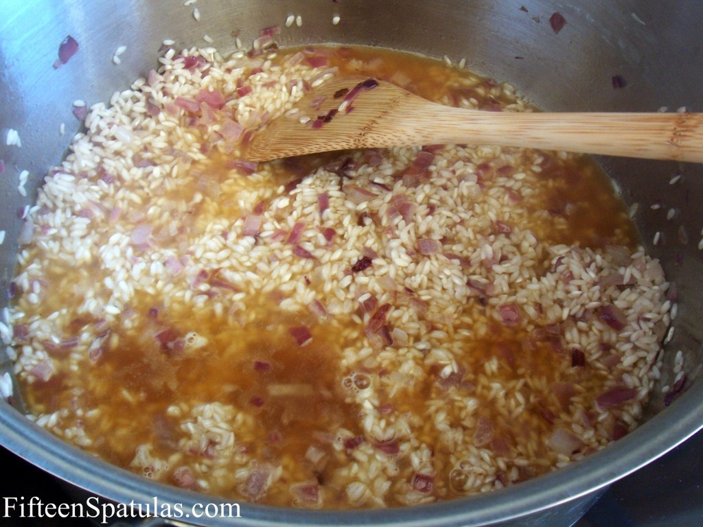 Cooking Arborio Rice in Stockpot with Red Onion