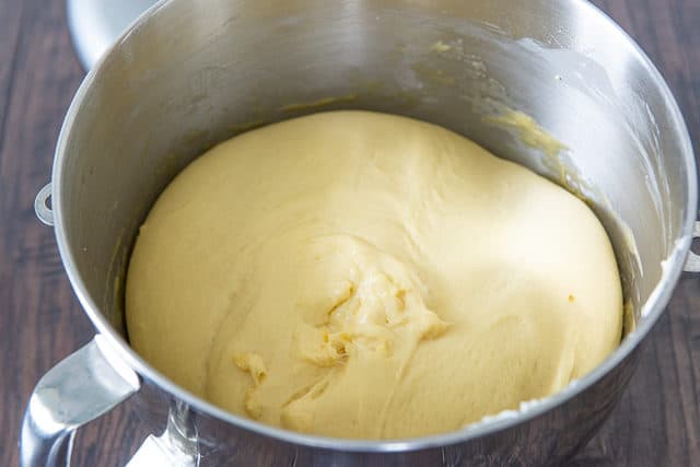 Risen Dough In Stand Mixer Bowl made with lots of butter and eggs