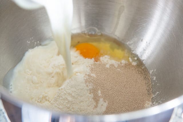 Yeast, Milk, Eggs, and Bread Flour in a Stainless Steel Bowl - How to Make Brioche 