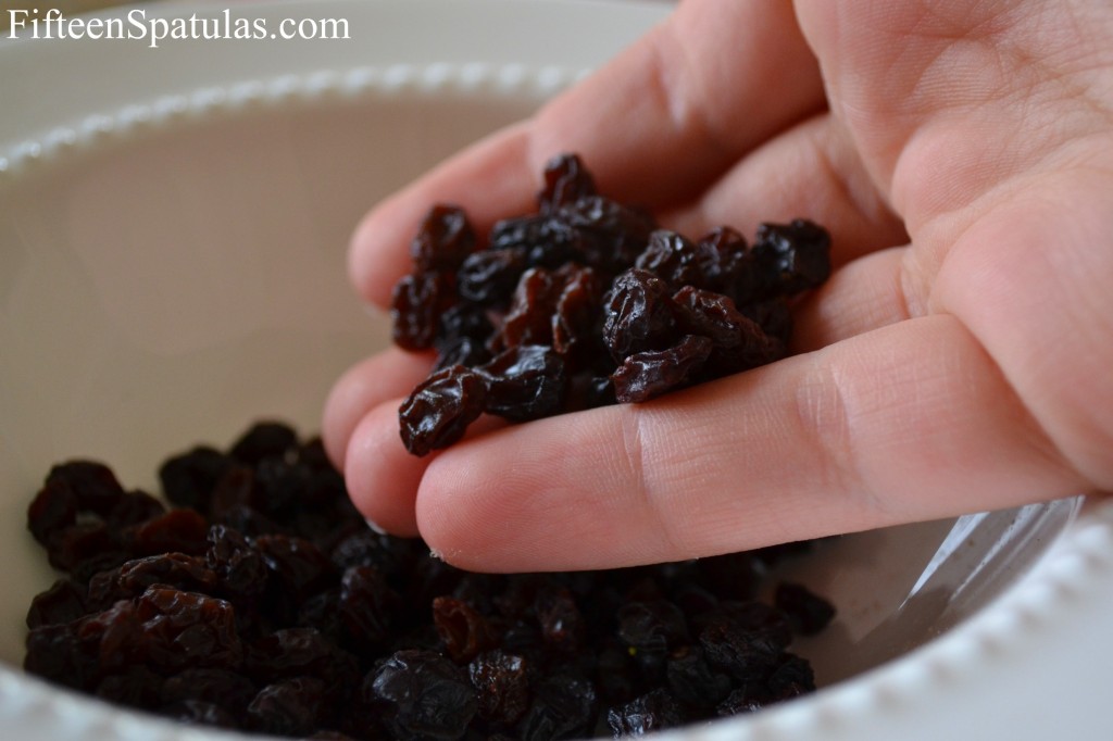 Black Currants Shown in Hand
