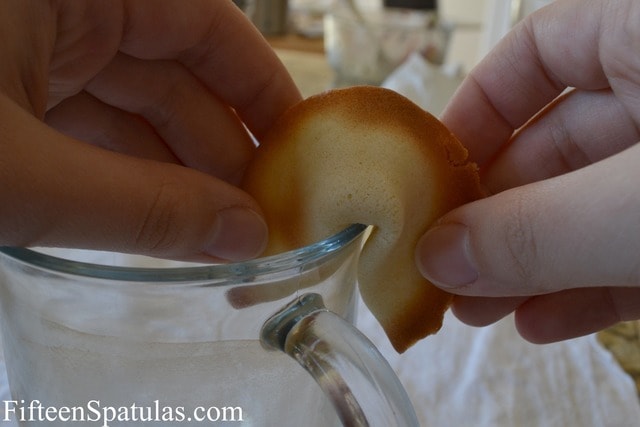 How to Make Fortune Cookies - By Crimping Cookie Over Edge of Glass