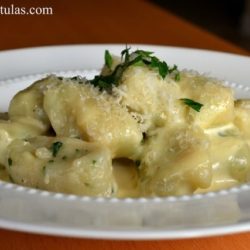 Potato Gnocchi - Served in White Bowl and Sprinkled with Herbs and Parmesan