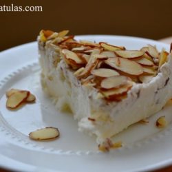 Tortoni - Sliced and Topped with Sliced Almonds on White Plate