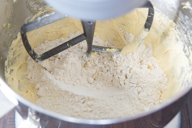 Adding flour to the dough mixture