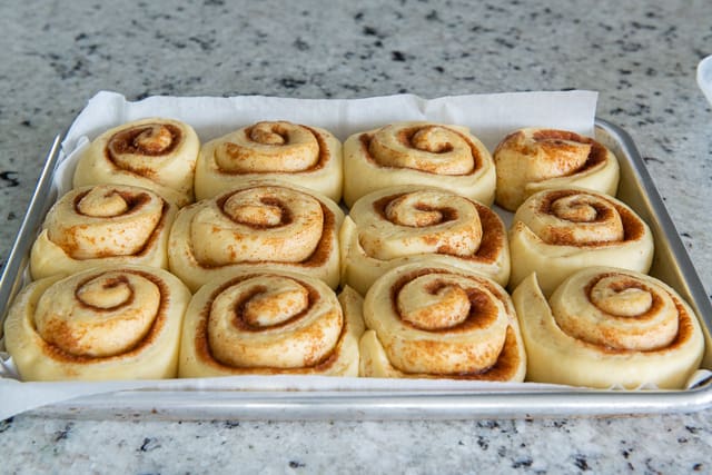 Risen and Puffy Cinnamon Rolls after Overnight Proof in Refrigerator Ready to Bake 