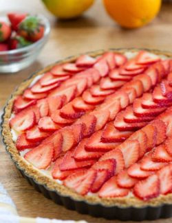 Strawberry Tart on a Wooden Board in the Metal Shell