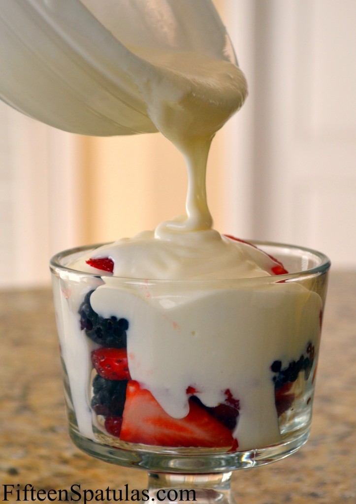 Drizzling Lavender Yogurt into Bowl with Berries
