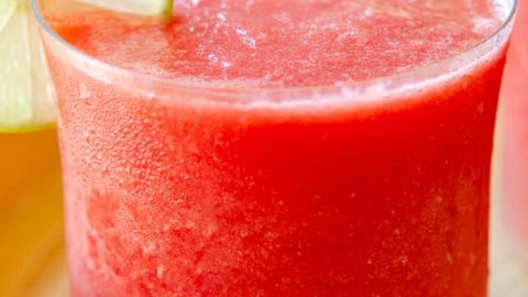 Watermelon Slushie - Poured in a Glass with Lime Wedge Garnish