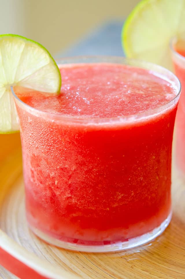Watermelon Slushie - Poured in a Glass with Lime Wedge Garnish 