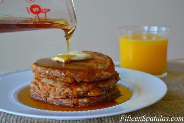 Carrot Pancakes - Stacked and Topped with Maple Syrup and Butter