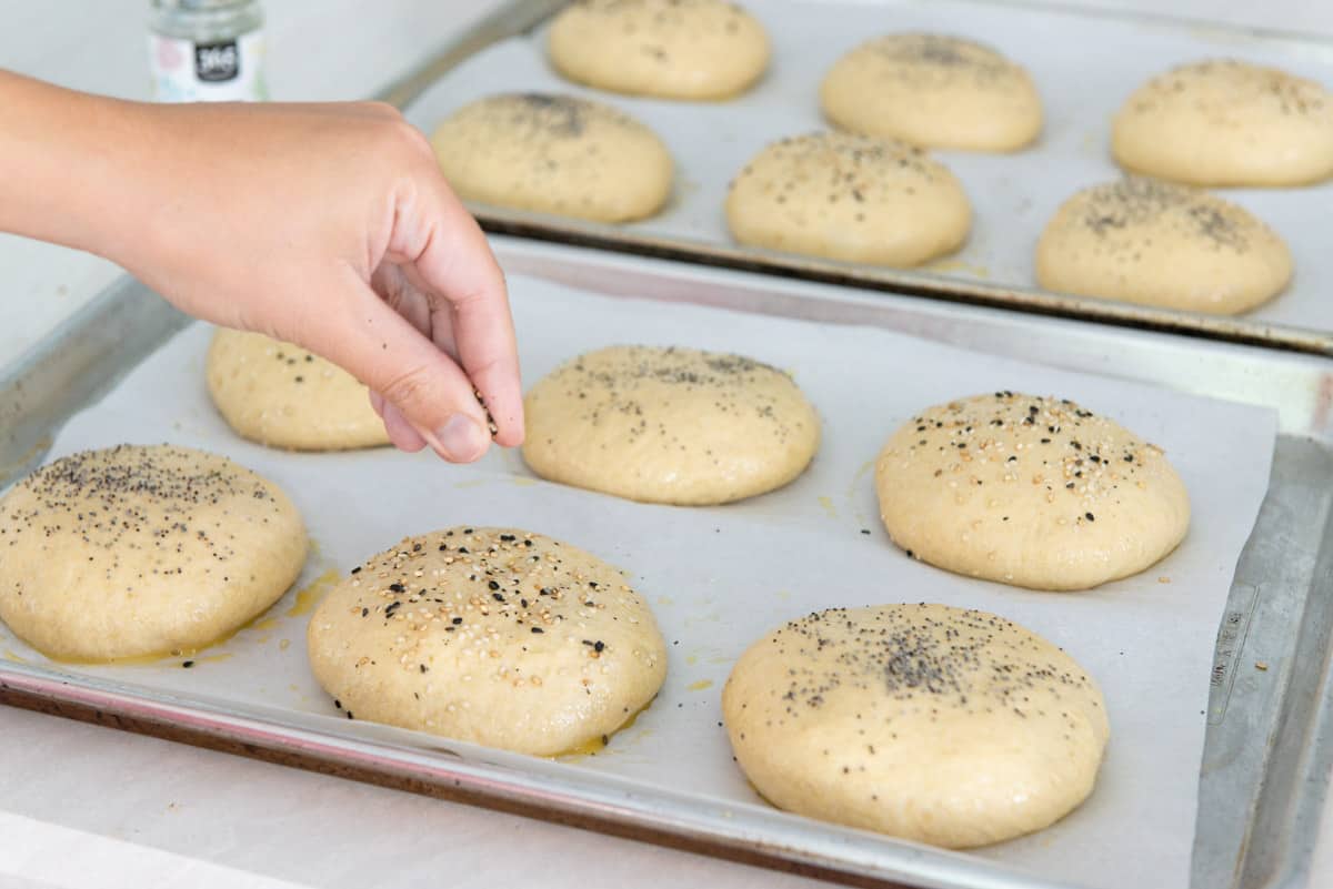 Sprinkling Sesame Seeds and Poppy Seeds On Each Piece