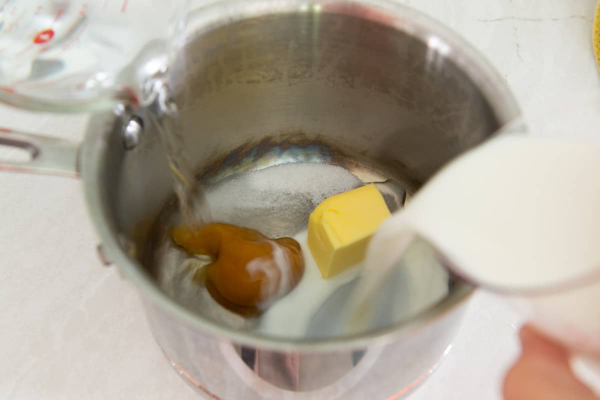 Honey, Butter, Water, Milk in a Saucepan