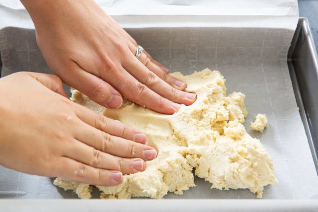 Pressing Shortbread Dough Into Parchment Lined Baking Pan