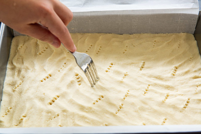 Pricking Shortbread Dough Layer with a Fork