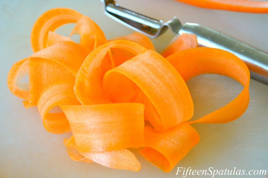 Carrot Ribbons on Cutting Board with Peeler