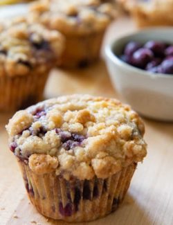 Blueberry Muffin on a Wooden Board with Crumb Topping