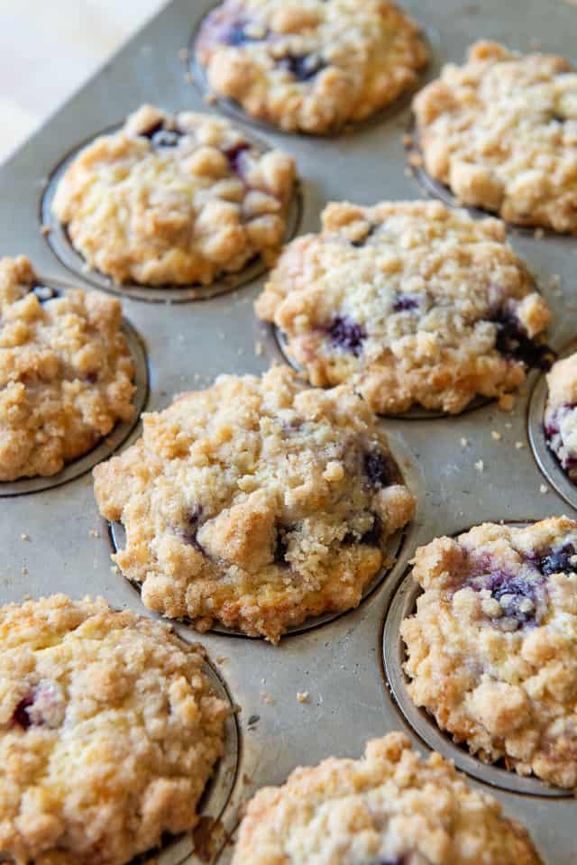 Best Blueberry Muffin Recipe - One Dozen muffins with golden crumb topping