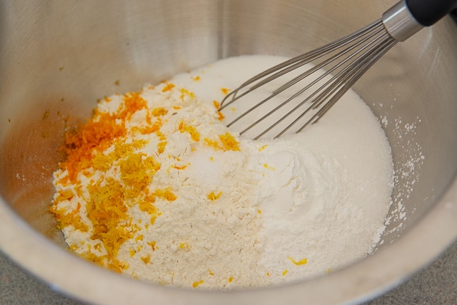 Flour, Sugar, baking Powder, Salt, Orange Zest, and Lemon Zest in a Bowl