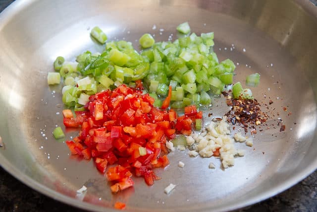 celery, bell pepper, scallions, garlic, and pepper flakes in a skillet