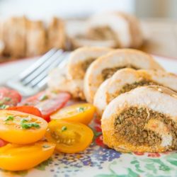 Chicken Roulade - Sliced On plate and filled with Sundried Tomato Pesto with Tomatoes