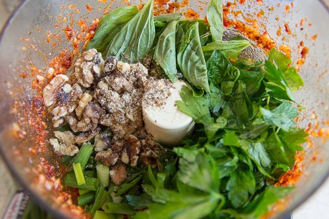 Fresh Basil and Walnuts With Sundried Tomato Paste in Food Processor bowl