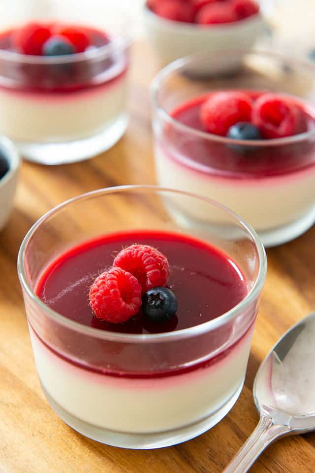 Panna Cotta Dessert - Served in Glasses with Raspberry Gelee and Berries