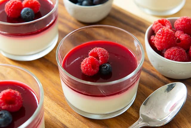 Panna Cotta Recipe - Served In Glasses with Fresh Berries On Top of Raspberry Gelee