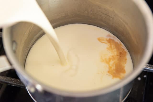 Adding Cream and Vanilla Extract to the Saucepan