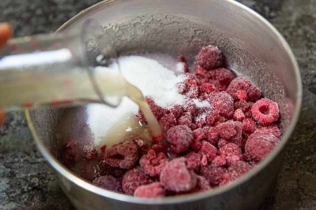 Frozen Raspberries, Sugar, and Lemon Juice Added to Saucepan