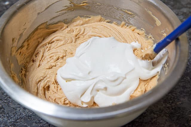 Adding Whipped Cream to Peanut Butter Pie Filling in Bowl