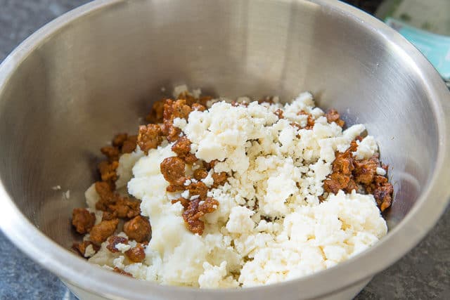 Mashed Potatoes In Bowl with Chorizo and Cheese Crumbles