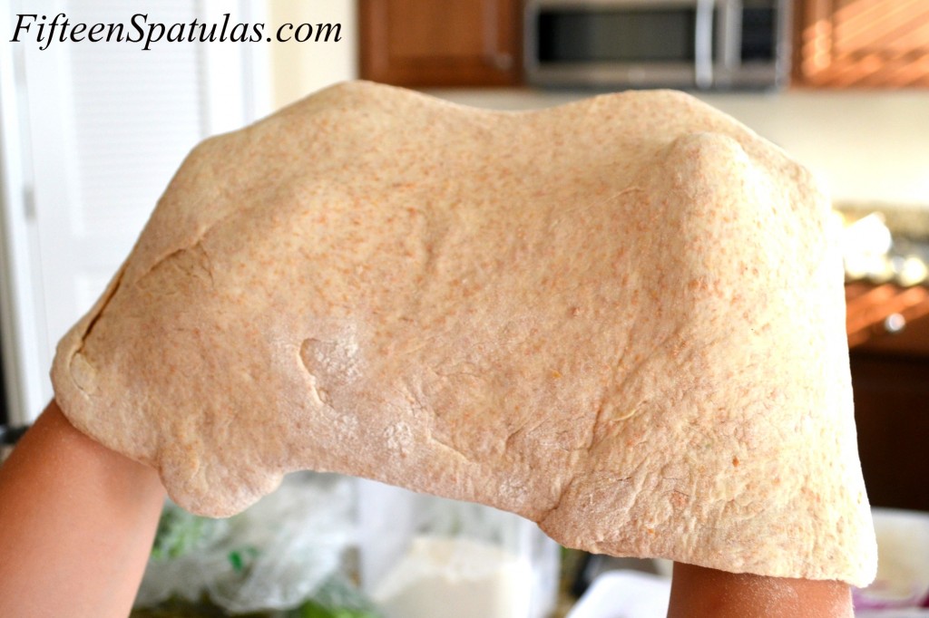 Stretching Pizza Dough in Air With Knuckles
