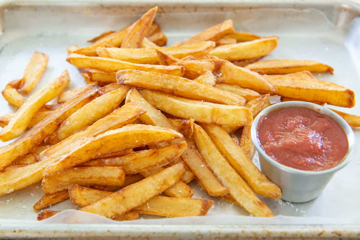 the Best Homemade French Fries On Tray with Ketchup Cup
