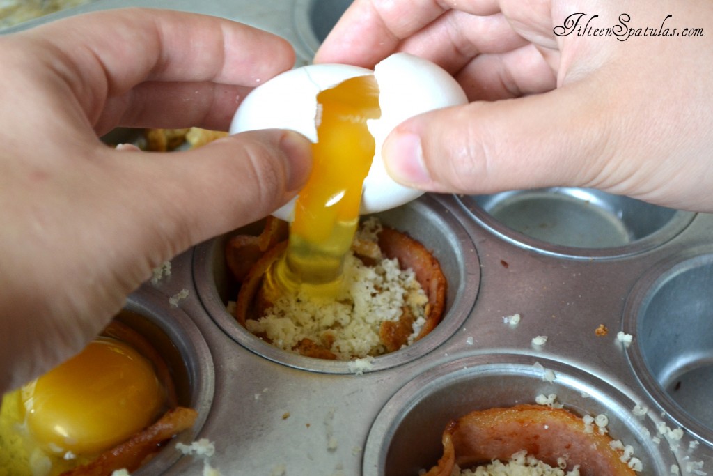 Cracking Egg Into Individual Bacon Egg Muffin Cups