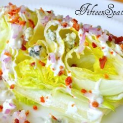 Iceberg Wedge - On White Plate with Red Onion, Crumbled Bacon, and Gorgonzola on Top