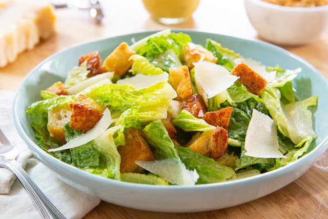Cesar Salad - In Blue Bowl with croutons and Parmesan Shavings