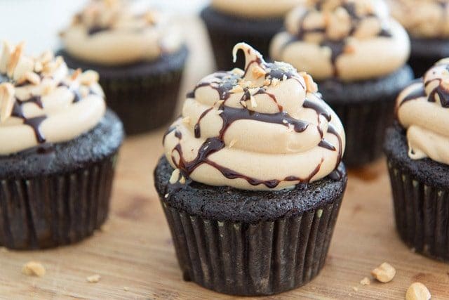 Chocolate Cupcakes with Peanut Butter buttercream Frosting with Chocolate Syrup Drizzle and Peanuts