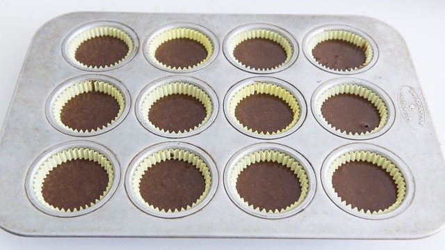 Chocolate Cake Batter in Paper Liner Muffin Wells