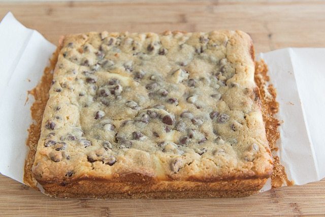 Fully Baked Cheesecake Cookie Bars on Cutting Board