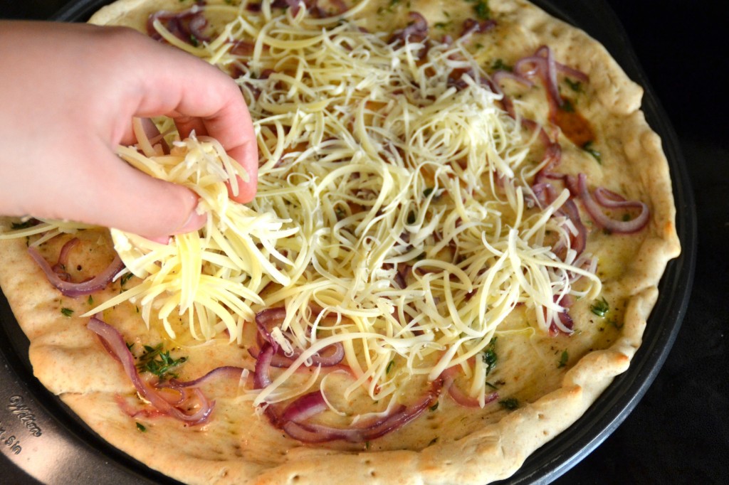 Adding Shredded Cheese to Gorgonzola Pizza