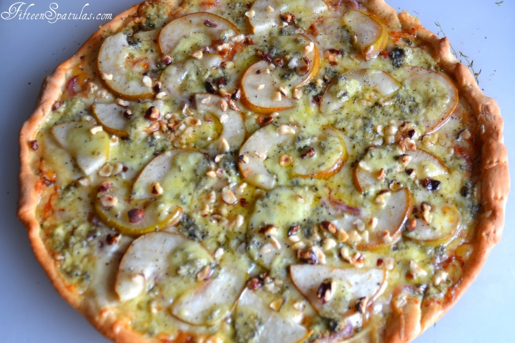 Pear and Gorgonzola Pizza - Pictured Whole with Hazelnuts on Top